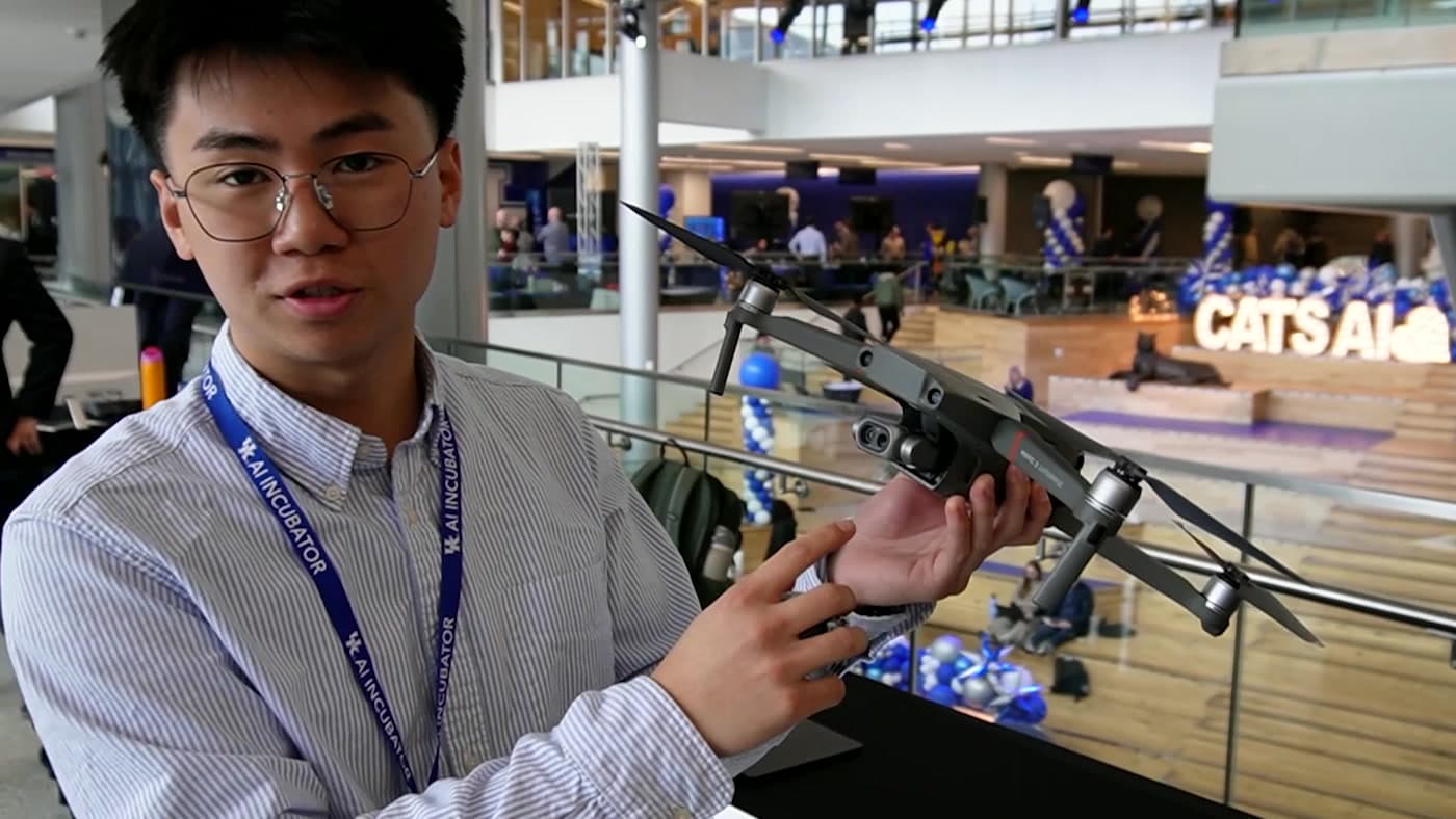 A University of Kentucky student showing a drone during an AI Incubator gathering